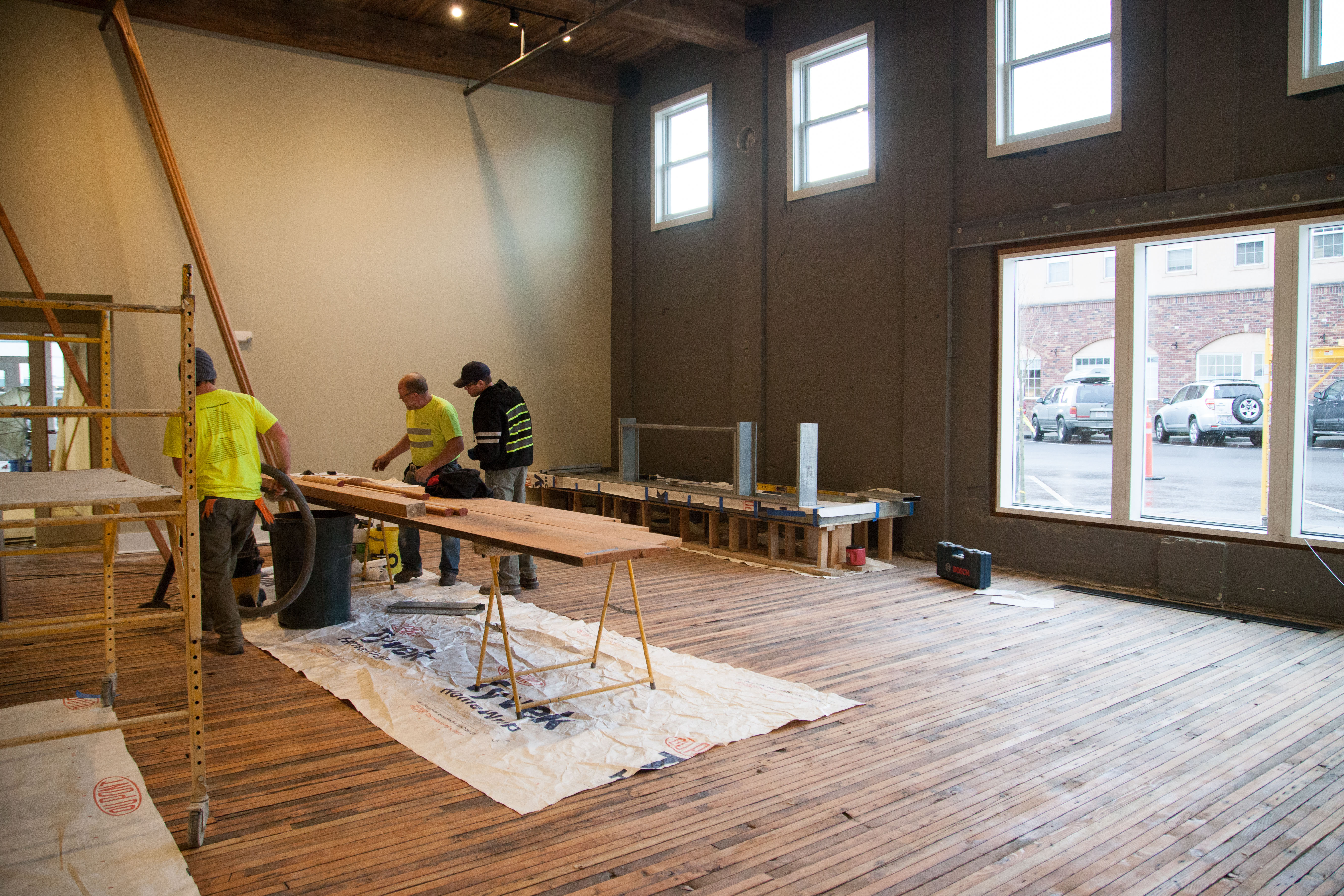 Contractors hard at work on the Inn at Lynden lobby space in the week before opening