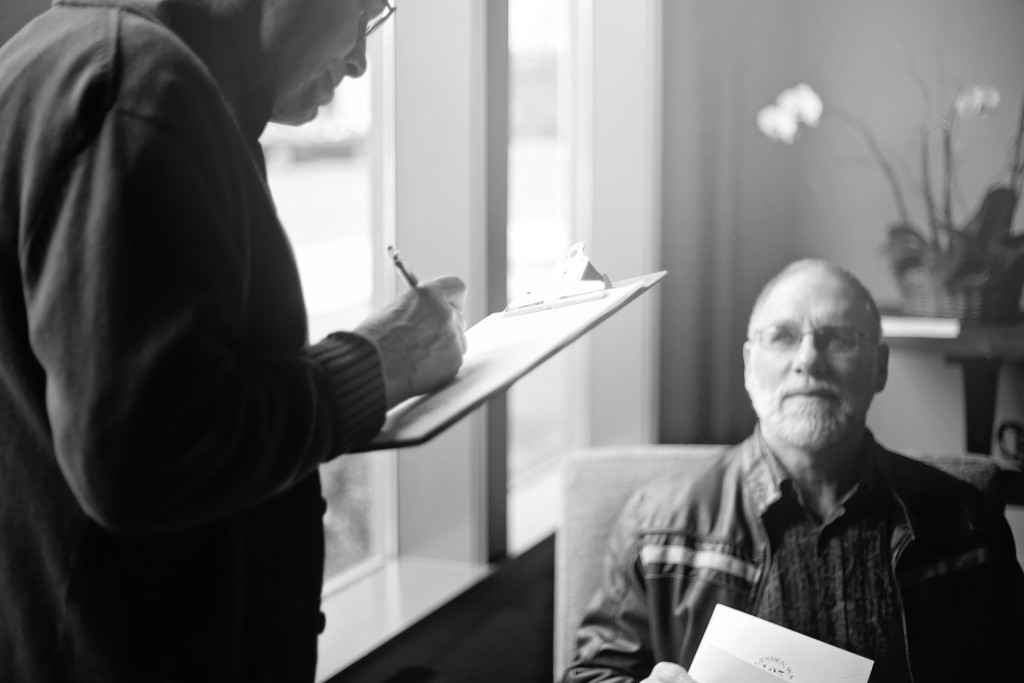 Judge Cliff Fast takes notes on a beard growing contestant.